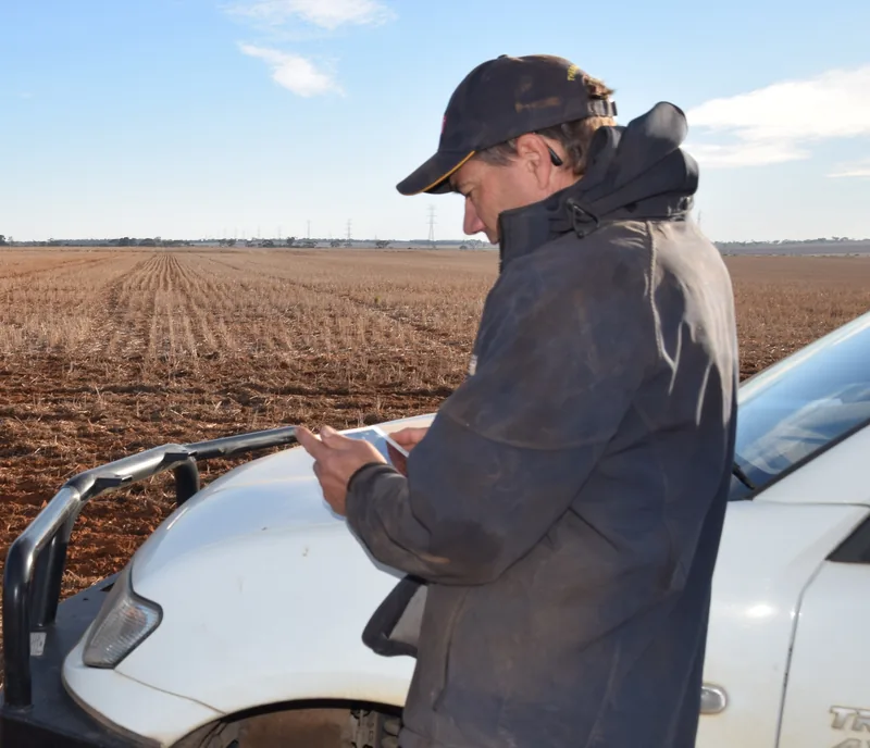 Farm adviser using iPad to review client business data