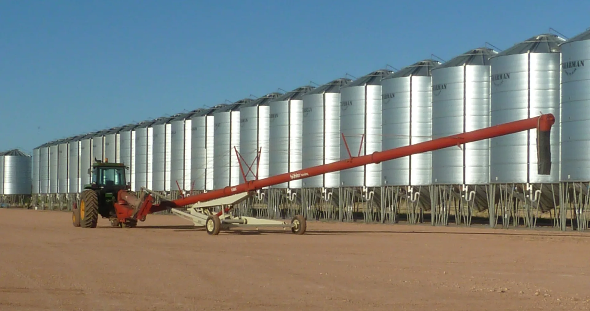 Grain silos at sunset - get the best deal from your bank with P2PAgri farm financial reports